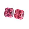 Two pink faceted gemstones with geometric cuts, placed side by side on a white background.