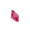 Pink faceted gemstone crystal on a white background with shining facets