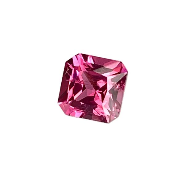 Faceted pink gemstone (diamond) on a white background, shown from a slight angle.