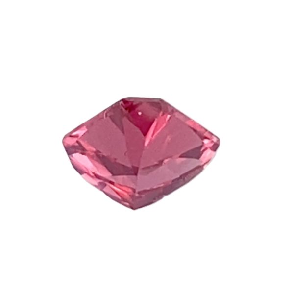 PSpin 42_3 - GEMWORLD LTD Pink cushion-cut gemstone with faceted surfaces on a white background.