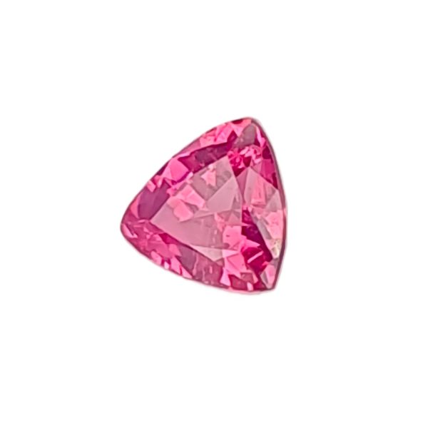Close-up of a faceted pink heart-shaped gemstone on a white background, showing sparkling facets.