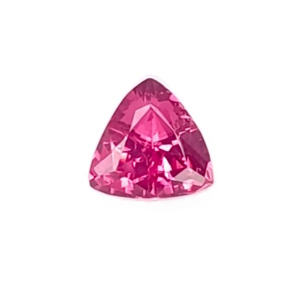 Pink faceted gemstone in a teardrop/pear shape on a white background with bright reflections area near the base.