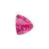Close-up of a faceted pink gemstone on a white background.