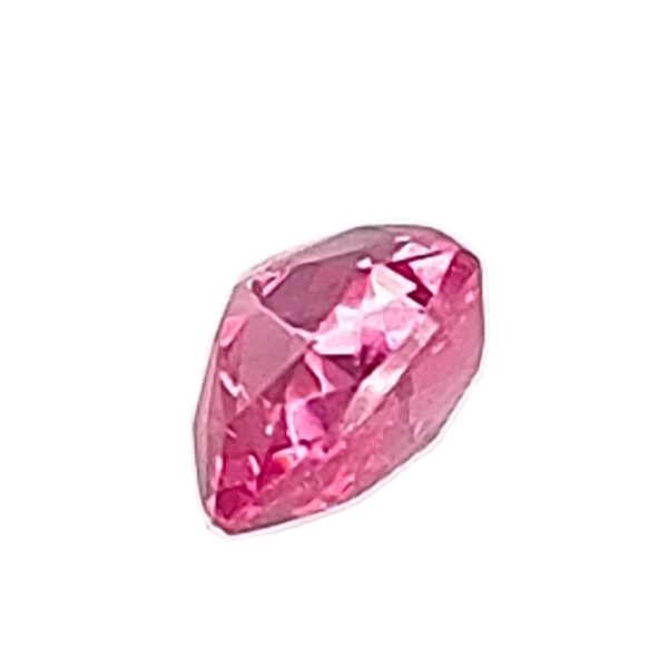 Heart-cut pink gemstone with faceted facets and bright highlights on a white background.