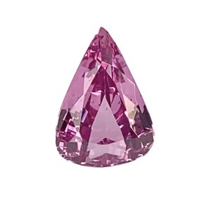 Faceted pink teardrop-shaped gemstone against a white background