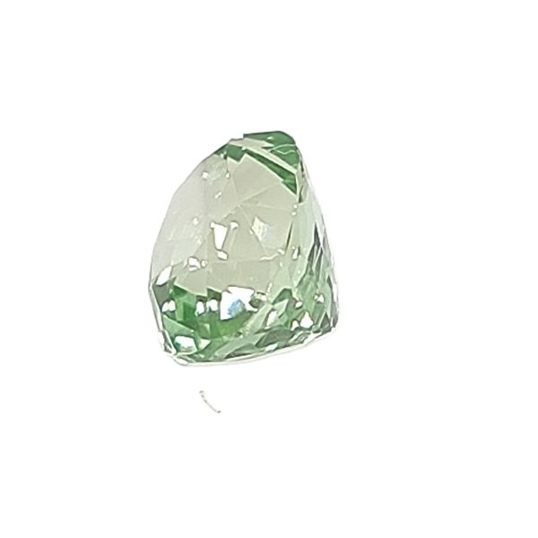 Close-up of a green, diamond-shaped foil balloon on a white background