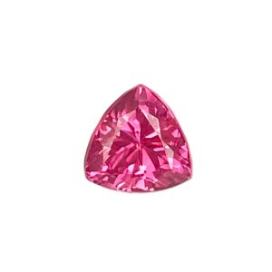 PSpin 124_8 - GEMWORLD LTD Partial view of a pink faceted gemstone with many reflective facets against a white background, teardrop shape visible at bottom center.