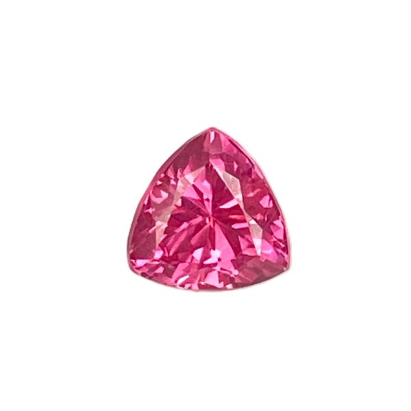 Partial view of a pink faceted gemstone with many reflective facets against a white background, teardrop shape visible at bottom center.