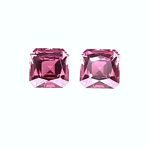 Two square-cut pink gemstones placed side by side on a light background.