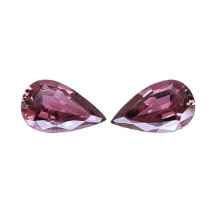 Tour 124125_3 - GEMWORLD LTD Two large faceted pink gemstone hearts partially visible at the bottom of the frame.