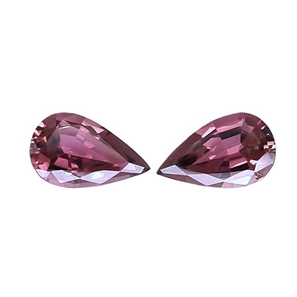 Tour 124125_3 - GEMWORLD LTD Two large faceted pink gemstone hearts partially visible at the bottom of the frame.