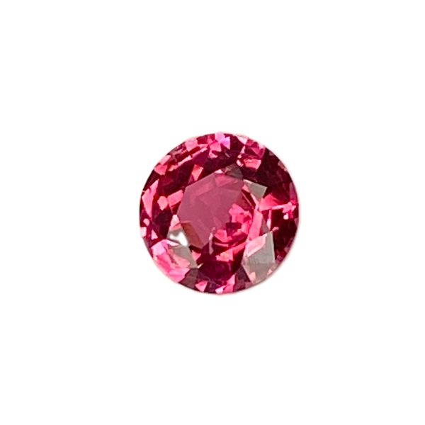 PSpin 118_1 - GEMWORLD LTD Close-up of a pink faceted gemstone (oval cut) with many reflective facets, shown partially in view.