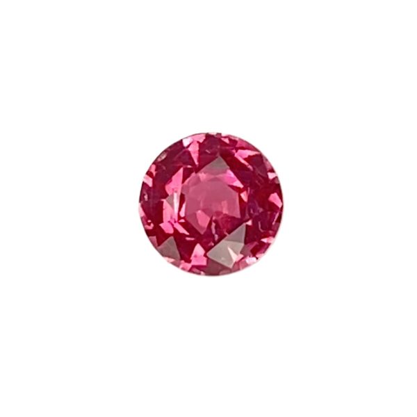 PSpin 118_4 - GEMWORLD LTD Close-up of a faceted oval pink gemstone set against a white background.