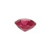 PSpin 118_6 - GEMWORLD LTD Faceted pink gemstone resting on a white background, showing multiple angular facets.