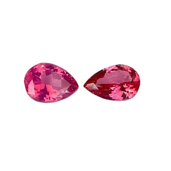 PSpin 138_4 - GEMWORLD LTD Two faceted pink heart-shaped gemstones on a white background, placed side by side for a decorative display