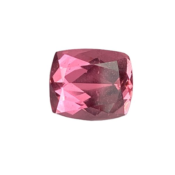 PSpin 59_1 - GEMWORLD LTD Close-up of a faceted pink gemstone with numerous angular facets reflecting light