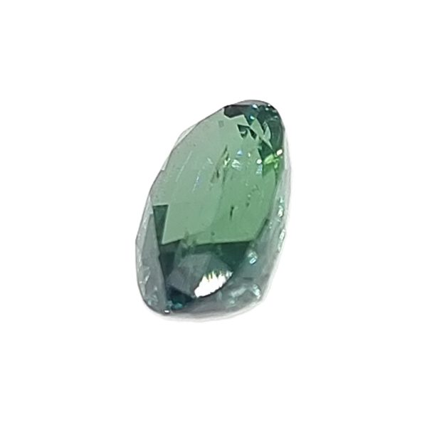 Korn 158_4 - GEMWORLD LTD Navette-cut green gemstone with faceted surfaces and a pointed tip, shown against a white background.