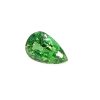 Close-up of a green faceted teardrop emerald against a white background.