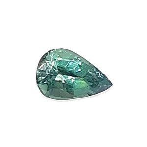 Korn 19_1 - GEMWORLD LTD Teal-green faceted gemstone cut into a rounded teardrop shape against a white background.