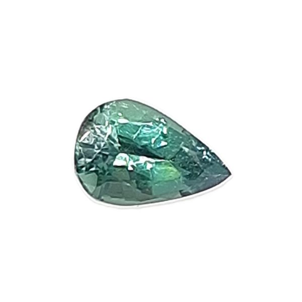 Korn 19_1 - GEMWORLD LTD Teal-green faceted gemstone cut into a rounded teardrop shape against a white background.