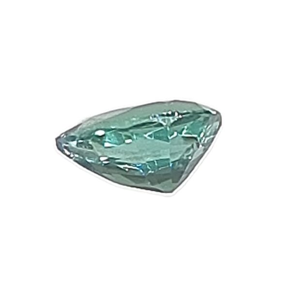 Korn 19_3 - GEMWORLD LTD Emerald-cut green gemstone wrapped in clear plastic, angled view.