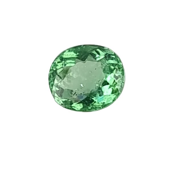 Par 16_2 - GEMWORLD LTD Green faceted gemstone sphere on a white background, close-up view of the emerald-like ball.