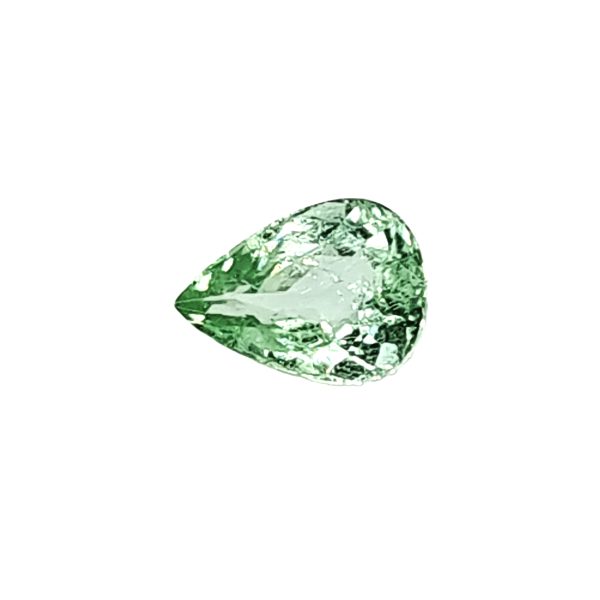 Close-up of a green emerald-cut gemstone with facets reflecting light on a white background.