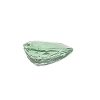 Green object wrapped in crinkled aluminum foil against a white background.