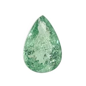 Par 36d_3 - GEMWORLD LTD Teardrop-shaped emerald with a faceted surface.