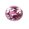 Close-up of a round pink faceted gemstone with multiple light-reflecting facets