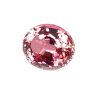 Close-up of a round pink gemstone with many facets catching the light.