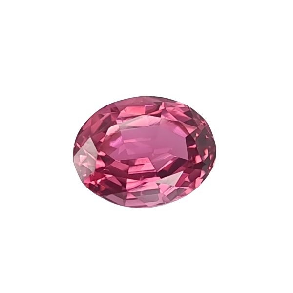 Tour 128_6 - GEMWORLD LTD Close-up of a pink faceted gemstone sphere with many angular facets catching light at the bottom edge of the image.
