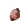 Tour 130_2 - GEMWORLD LTD Faceted brownish-pink gemstone photographed close up on a white background.