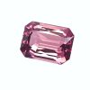 Close-up of a pink faceted gemstone with angular, reflective facets.