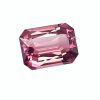 Close-up of a pink/purple faceted gemstone with sharp cuts and reflections.