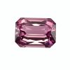 Close-up of a pink, faceted gemstone with many reflective facets on a white backgroundesh