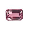 Close-up of a pink-red faceted gemstone with an octagonal cut on a white background.