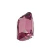 Faceted pink gemstone with sharp edges set against a white background, close-up view