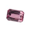 Pink faceted gemstone with rectangular-cut facets, close-up detail on a white background.