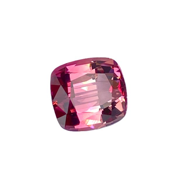 Tour 2_2 - GEMWORLD LTD Faceted pink ruby gemstone on a white background, oval shape and sparkling facets