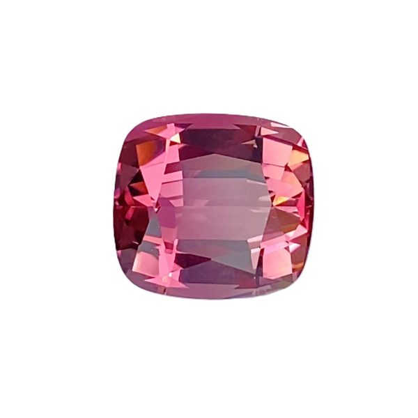 Tour 2_4 - GEMWORLD LTD Close-up of a faceted pink gemstone with vivid magenta facets reflecting light