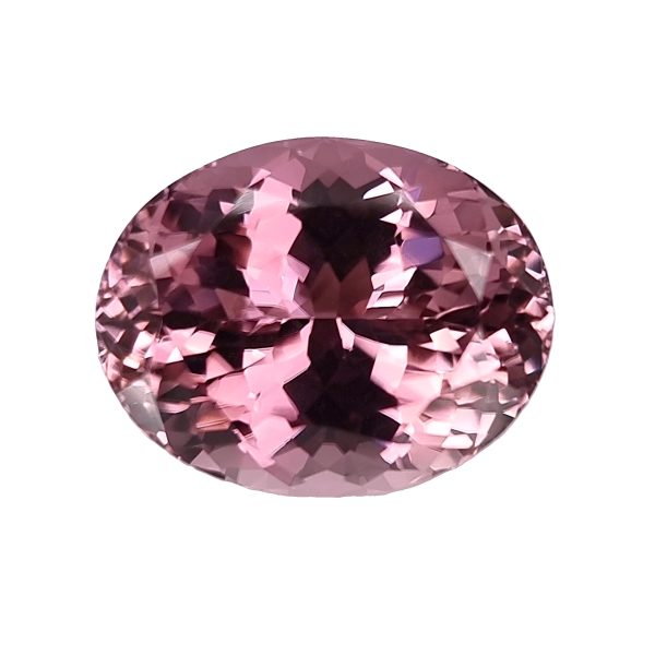 Tour 36_1 - GEMWORLD LTD Partial view of a pink faceted gemstone sphere, close-up showing sparkling facets.