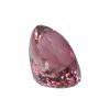 Tour 36_3 - GEMWORLD LTD Pink faceted gemstone, close-up detail of a cut crystal with light reflections.
