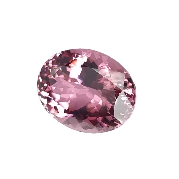 Tour 36_4 - GEMWORLD LTD Close-up of a pink faceted gemstone against a white background.