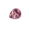 Close-up of a pink faceted gemstone/crystal with multiple facets catching the light (partial view)