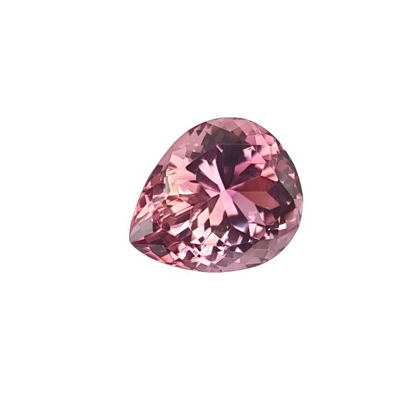 Close-up of a pink faceted gemstone/crystal with multiple facets catching the light (partial view)