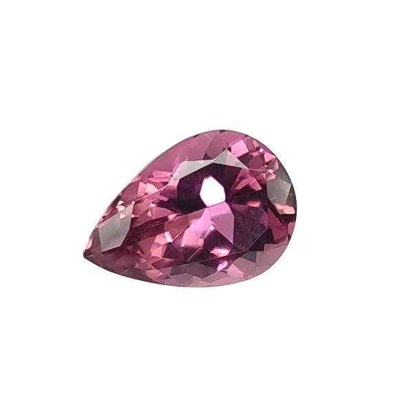 Tour 52_2 - GEMWORLD LTD Close-up of a faceted pink gemstone with multiplereflective facets and a teardrop shape, catching light from the side.