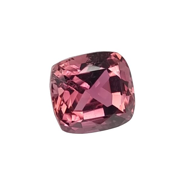 Close-up of a faceted pink gemstone catching the light.
