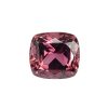 Close-up of a faceted pink gemstone with a rounded rectangular cut, showing rich pink and purple facets catching light