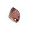 Close-up of a pink faceted gemstone isolated on white background, showing angular crystal facets.